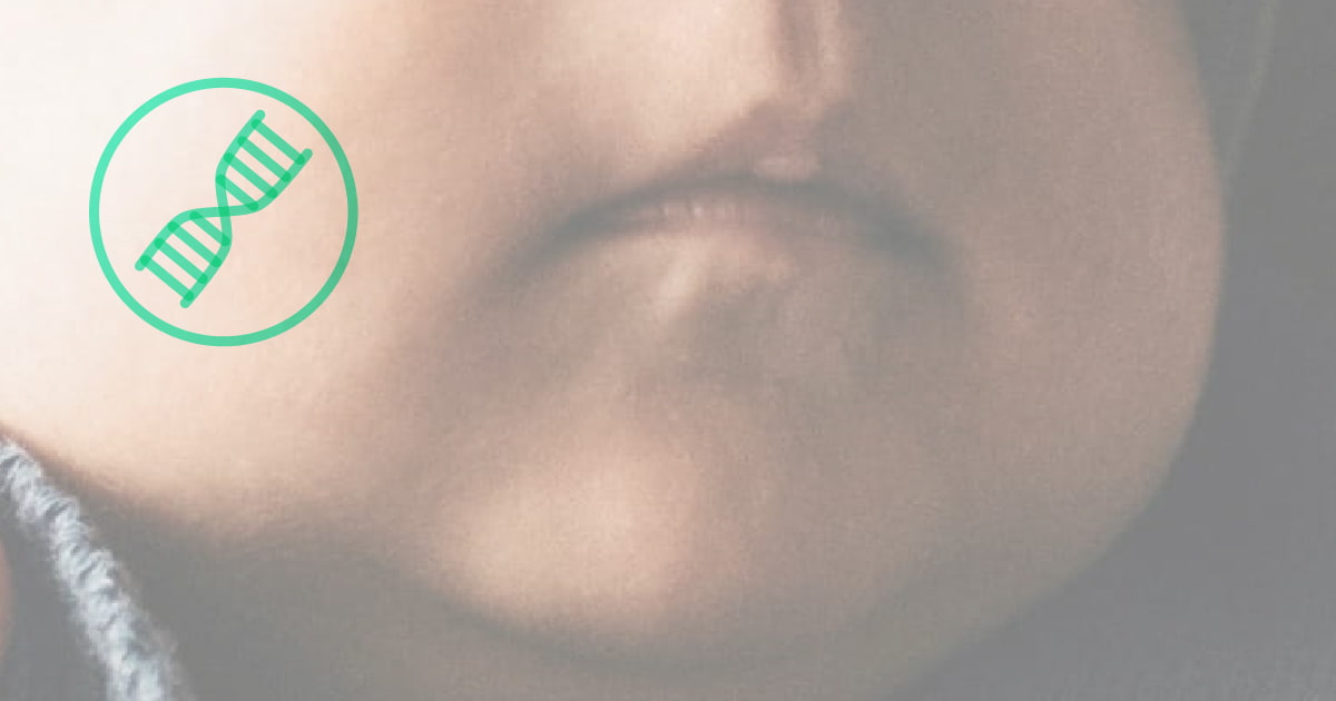 Close up baby face with gene icon on cheek